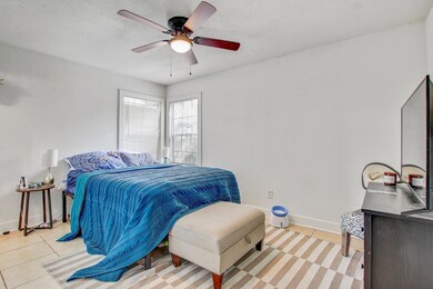 Bedroom featuring light tile patterned floors and