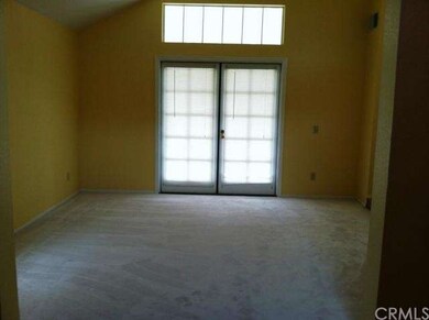 Formal Living room w/ French doors to front patio.