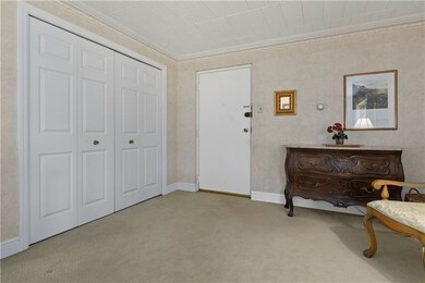 The entrance to the apartment featuring a spacious