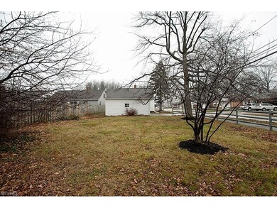The back yard has plenty of room for family fun ti