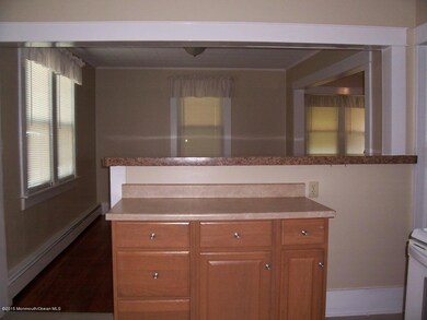 VIEW FROM KITCHEN INTO DINING ROOM
