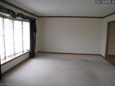 Large living room with bay window.