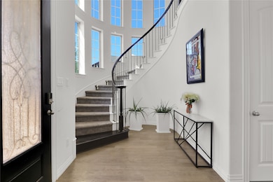 Elegant entry with stairs off to the side.