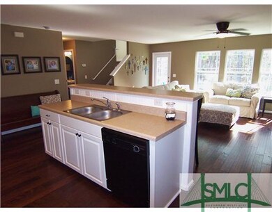 Living Room. Kitchen overlooks living area making 