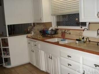 Tiled kitchen counters and newer cabinets