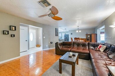 Front Entry and Living Room (view of Dining Room &