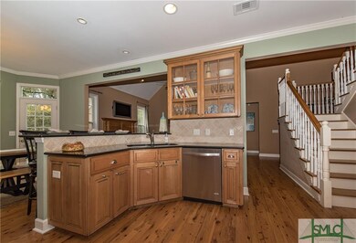 Glass acents in the kitchen cabinetry, hardwood fl