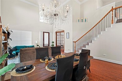 Dining room with hardwood / wood-style floors, a t