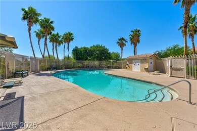 Community pool featuring a patio area