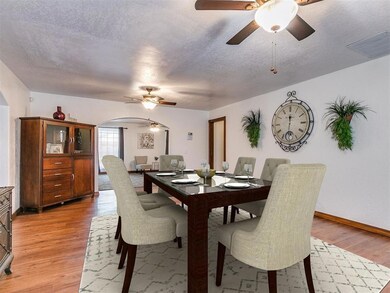 Dining area with a textured ceiling, ceiling fan, 