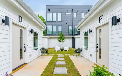 View of grassy yard featuring a patio area