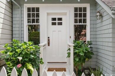 Charming curb appeal with a white picket fence and