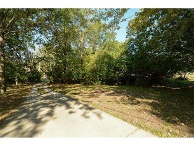 Private tree covered winding driveway
