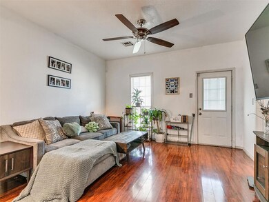 Living room with luxury plank flooring anda  ceili