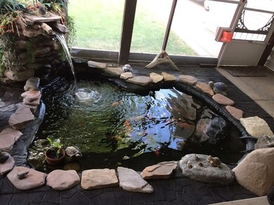 Pond with Koi fish in enclosed porch