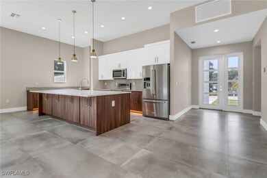Kitchen with appliances with stainless steel finis