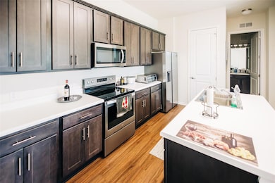 Kitchen featuring appliances with stainless steel