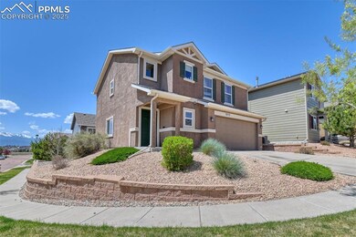 View of front of house featuring an attached garage, driveway, and stucco siding