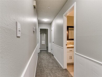 Main hallway into guest bathroom and bedrooms