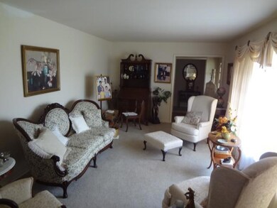 Living room is a comb. with the dining room. Good light in both rooms.