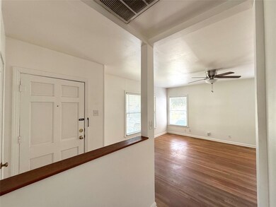 Entrance foyer featuring dark wood-type flooring,
