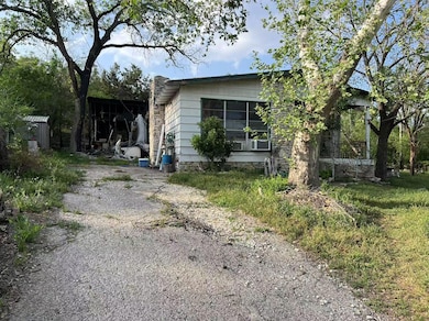 View of property exterior featuring an outbuilding