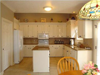 Kitchen with Granite counters and Island