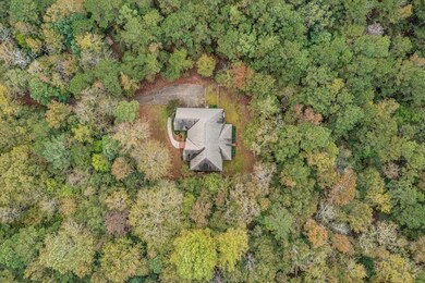 Nestled on 2.52 acre wooded lot