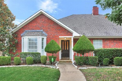 Beautiful drive-up with mature landscaping and mat