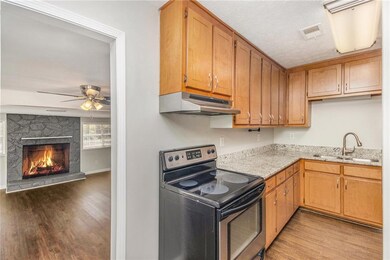 Kitchen with stainless steel electric range oven, 