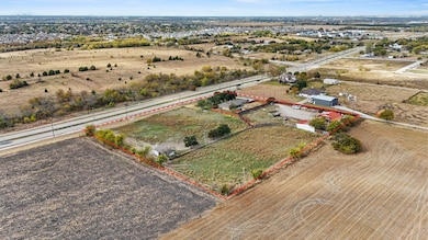Aerial view of sparsely populated area featuring property boundaries highlighted