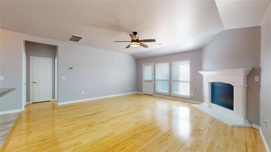 Windows allow for natural lighting in the large li