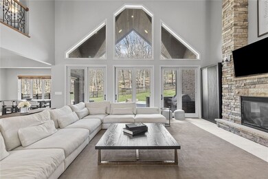 From the foyer enter the expansive great room with