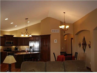 Vaulted ceiling continues into the open kitchen ar