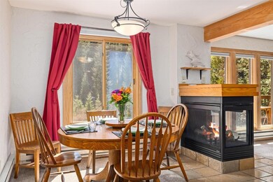 Dining room with a gas fireplace and views to the