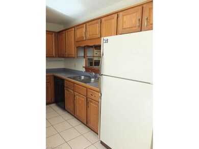 Kitchen has tile flooring.