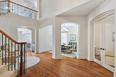 Foyer entrance with a notable chandelier, french d