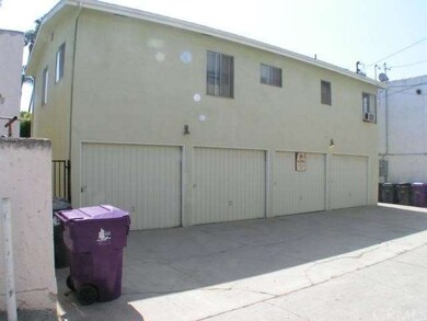Rear alley view of four garages
