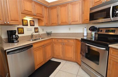 Kitchen features raised panel wood cabinetry, soli