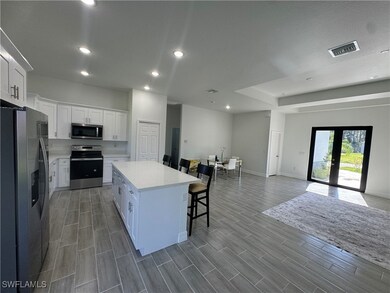 Kitchen featuring stainless steel appliances, a br