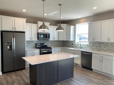 An awe-inspiring kitchen with a beautiful styled island is the perfect place for friends and family to gather around for years to come.