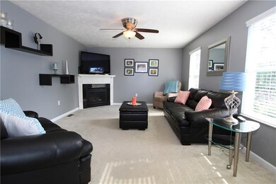 The family room has tons of natural light, neutral