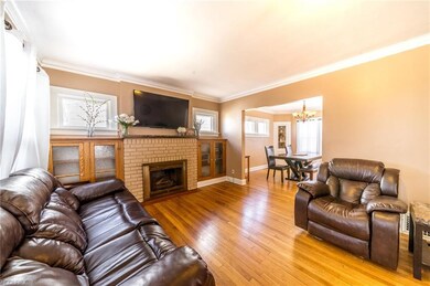 Living room features a brick fireplace, great buil