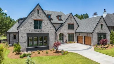 View of front facade featuring an attached garage,