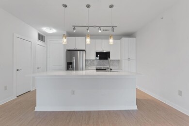 Kitchen featuring stainless steel appliances, tas
