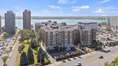 View of urban area with apartment complex and a nearby body of water