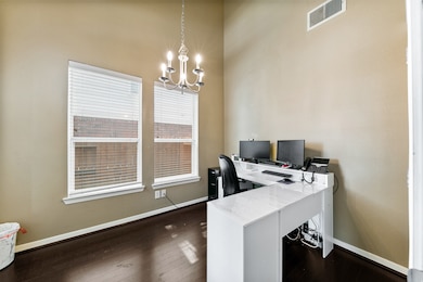 Spacious study with high ceilings and large window
