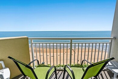 Balcony with a view of the beach and a water view