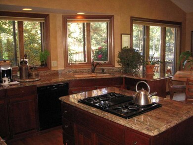 Gas Cooktop and Many Windows in Kitchen