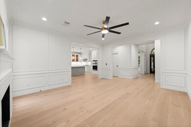 LIVING ROOM View into the Kitchen. Openly integrated plan with just the right amount of space defining.